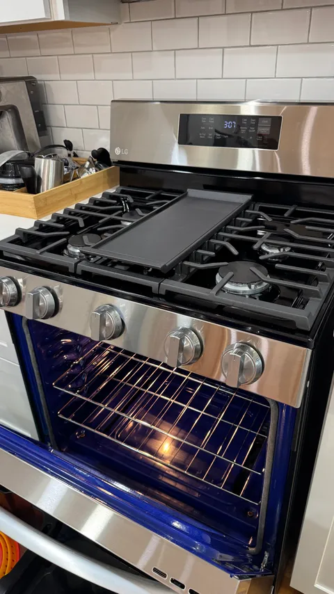 Stainless gas range with a spotless cooktop and deep-cleaned oven interior