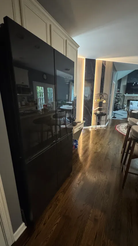 Smudge-free refrigerator doors and gleaming hardwood floors after cleaning