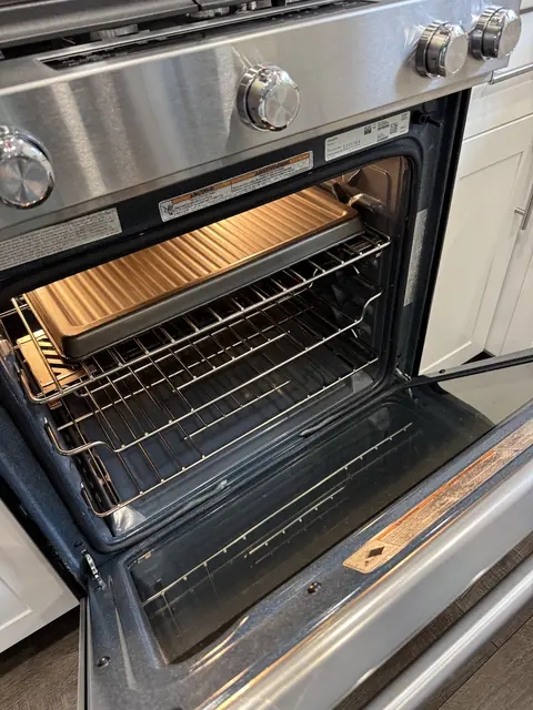 Deep-cleaned oven interior with polished racks and spotless door