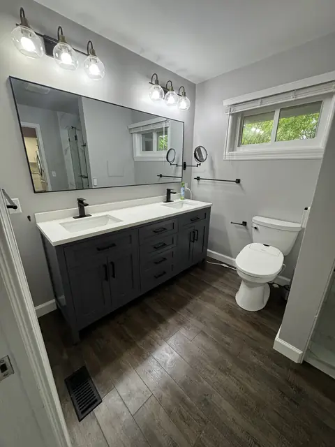 Spotless modern bathroom with clean vanity mirror floor and fixtures
